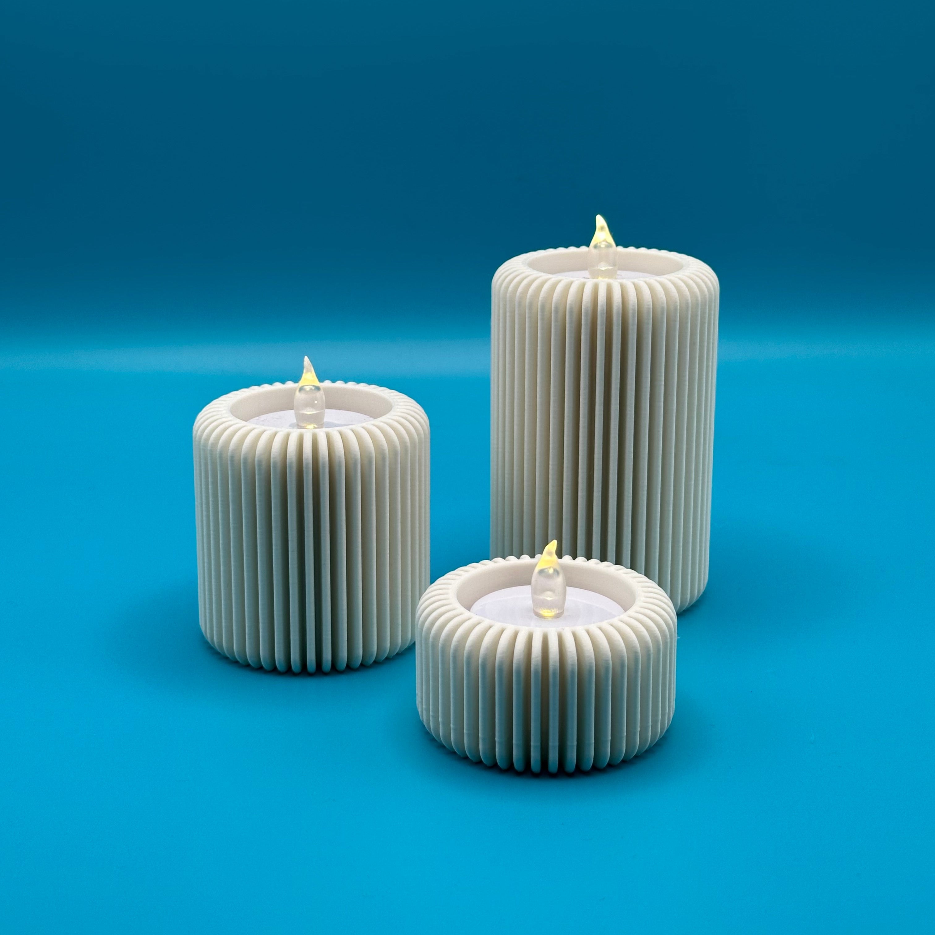 Conjunto de tres portavelas modelo Fins 1 con diseño minimalista y elegante