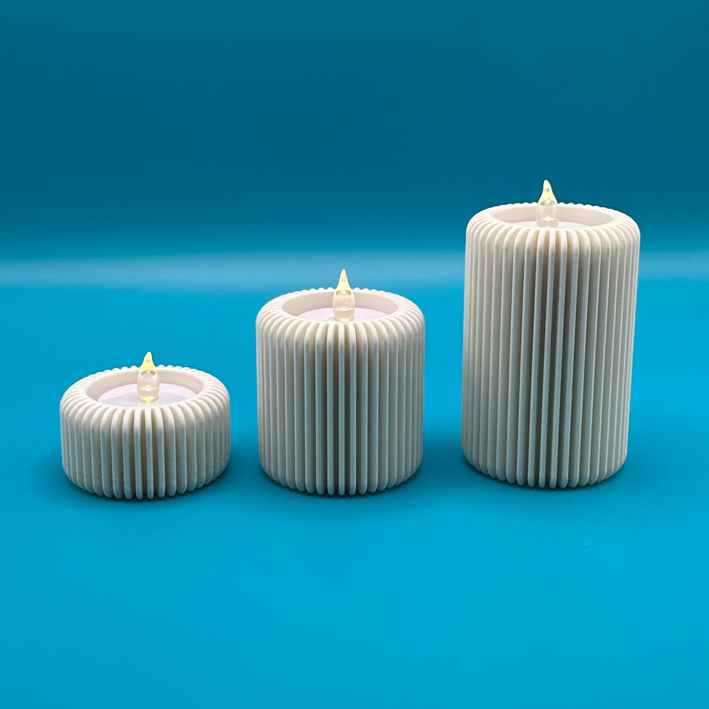 Conjunto de tres portavelas modelo Fins 1 con diseño minimalista y elegante